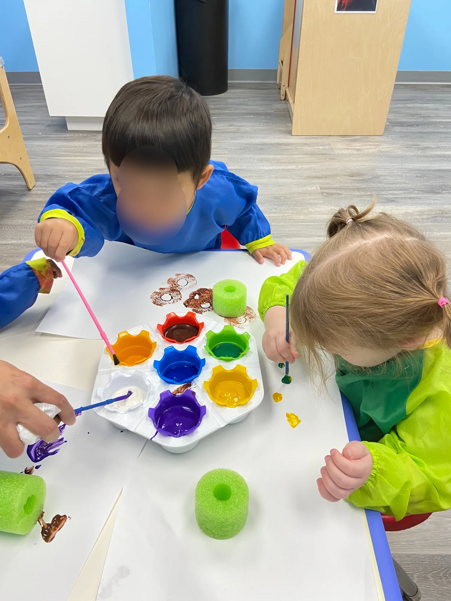 Village Scholars Preschool photo: colour mixing with brushes and palettes