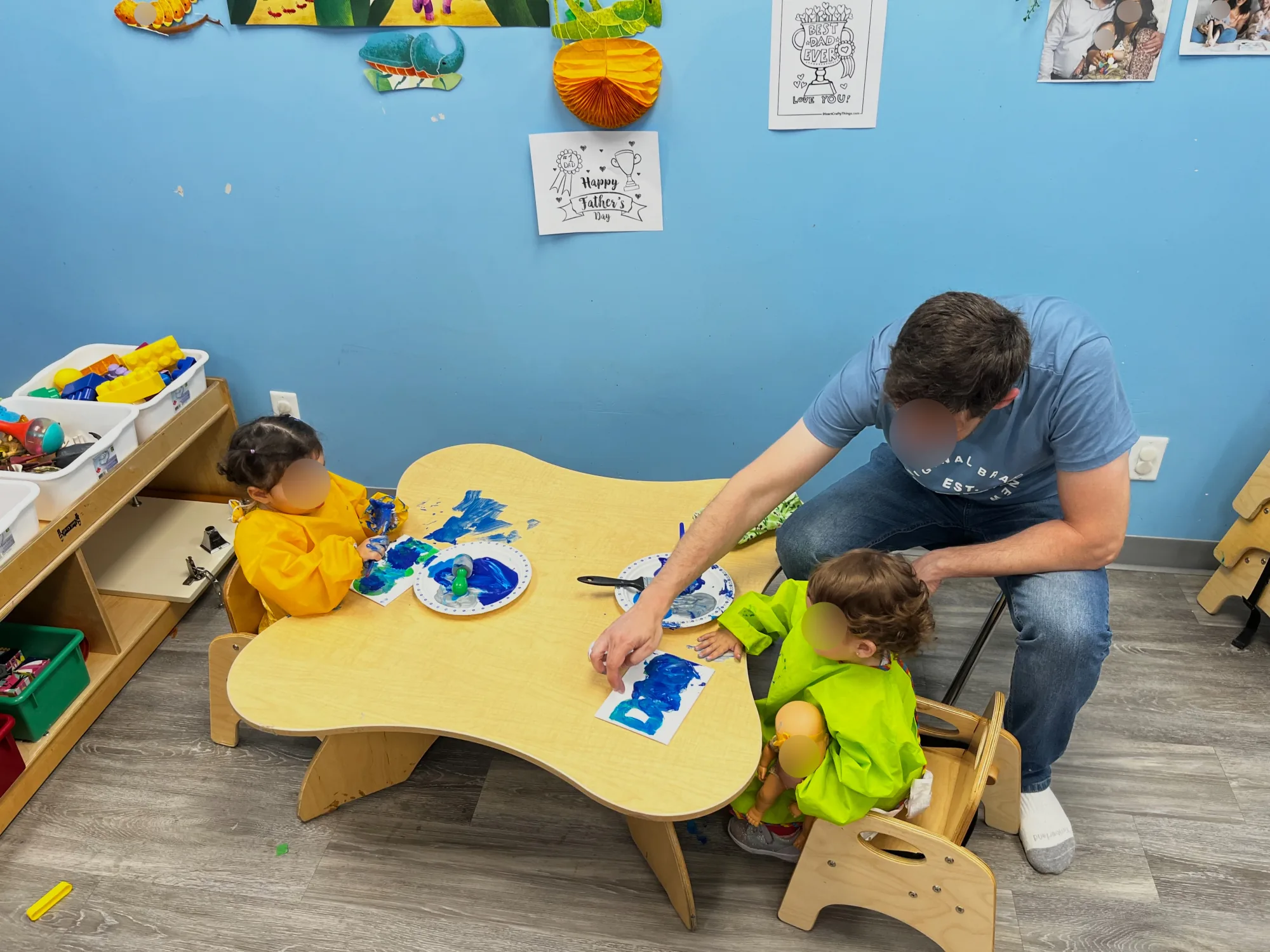Village Scholars Preschool photo: painting together at a child-sized table
