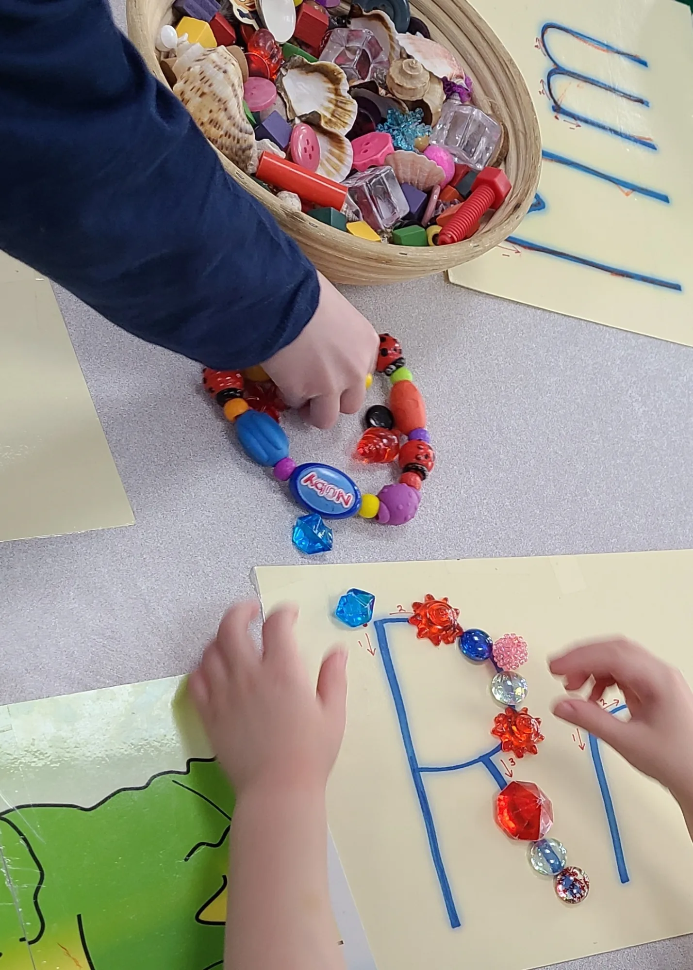 Village Scholars Preschool photo: beading and fine-motor design