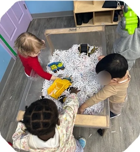 Village Scholars Preschool photo: snow sensory play with toy vehicles